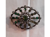 We remodelled this diamond set brooch into five different emerald and diamond rings - everyone shares the family heirloom
