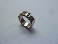 Platinum wedding ring with diamonds rough set on each edge