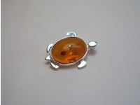 Tortoise brooch with amber centre
