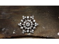 This brooch, together with a pearl and diamond brooch was dismantled and made into a ring and earring suite