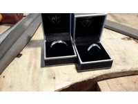 18ct white gold and palladium rings made by the happy couple on a course