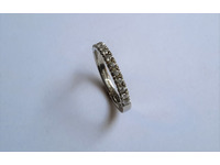 Platinum wedding ring, top set with diamonds in claw setting