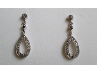 Stunning diamond drop earrings made using stones from the brooches