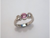 Palladium three stone pink sapphire and diamond ring