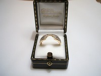 18ct yellow and white gold wedding ring cut to fit around engagement ring, pave set with diamonds