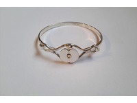 Sterling silver, and 9ct yellow gold 'apple' bangle.