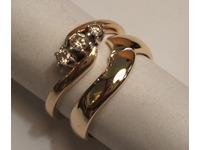 9ct yellow gold shaped wedding ring with three stone diamond engagement ring