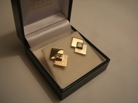 18ct yellow gold earrings set with princess cut diamonds