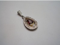 Yellow and white gold pear shaped ruby and diamond pendant