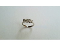 Platinum three stone diamond ring, fancy bezel