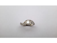 Platinum and diamond crossover style ring