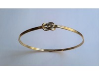 Diamond set gold bangle.