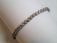 Platinum and diamond tennis bracelet.