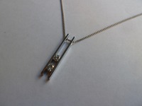 White gold pendant set with two brilliant cut diamonds