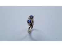 Platinum two stone tanzanite cross over ring