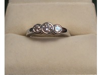 Platinum and diamond three stone ring