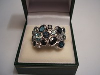 9ct white gold dress ring set with sapphires,blue topaz & aquamarine