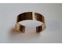 Wide gold bangle, hammer finish.