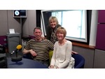 Rick and Maggie on the sofa, with Lesley Dolphin